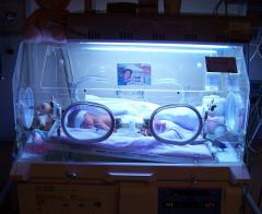 Infant in incubator